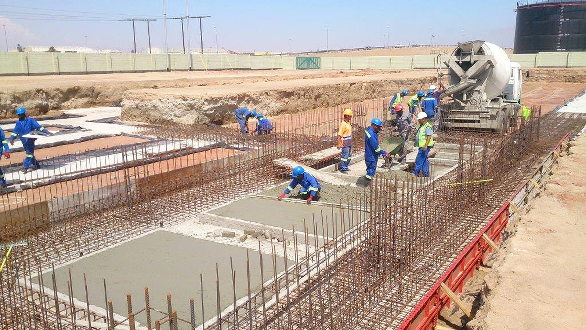 Nofrica crew finishing a reinforced concrete slab